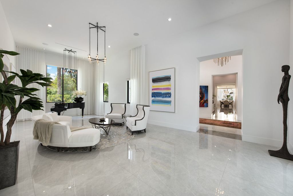 The Home in Boca Raton is a newly renovated Estate in the prestigious Royal Palm Yacht and Country Club with resort-style amenities now available for sale. This home located at 231 Thatch Palm Dr, Boca Raton, Florida