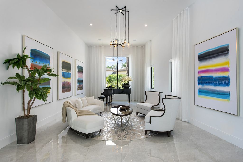 The Home in Boca Raton is a newly renovated Estate in the prestigious Royal Palm Yacht and Country Club with resort-style amenities now available for sale. This home located at 231 Thatch Palm Dr, Boca Raton, Florida