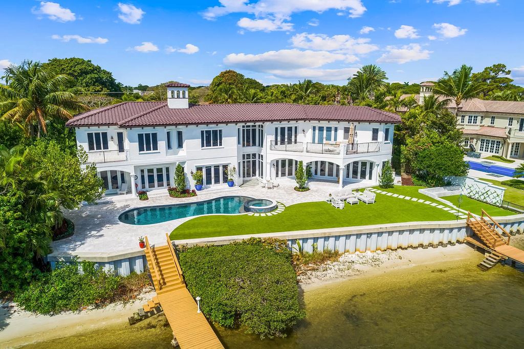 The Home in Jupiter is a newly renovated transitional custom estate with detached guest house, private tennis court and 2 gated entries for complete privacy now available for sale. This home located at 19000 Point Dr, Jupiter, Florida