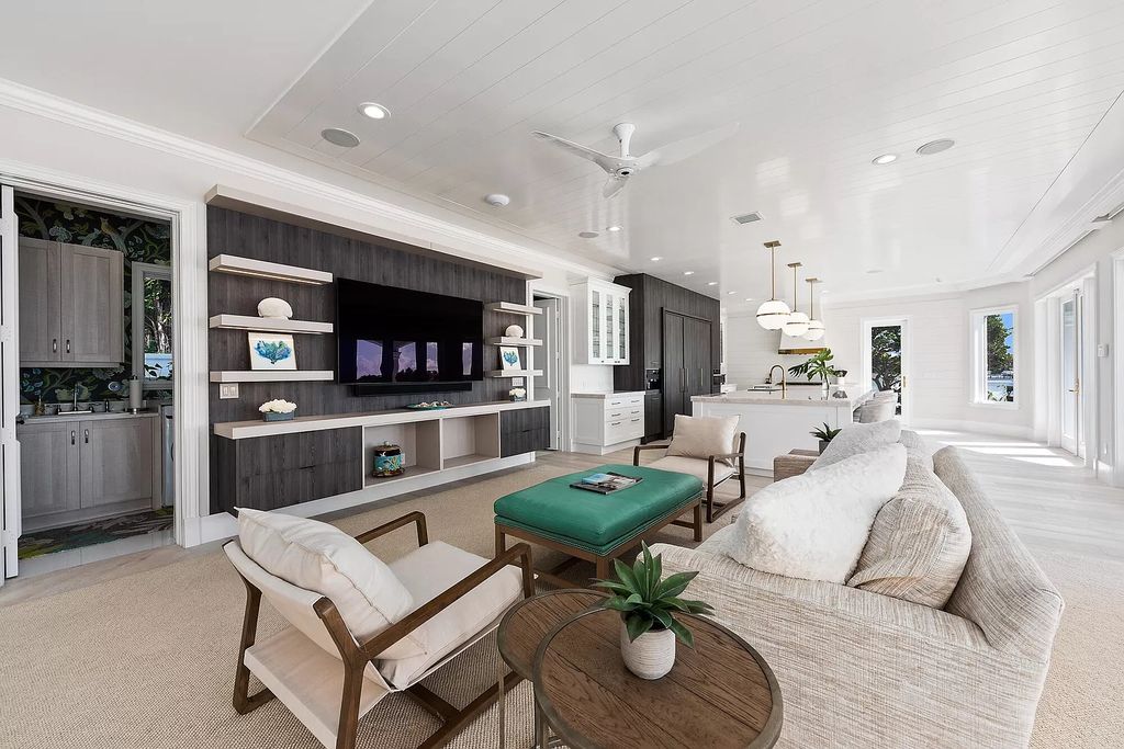 The Home in Jupiter is a newly renovated transitional custom estate with detached guest house, private tennis court and 2 gated entries for complete privacy now available for sale. This home located at 19000 Point Dr, Jupiter, Florida