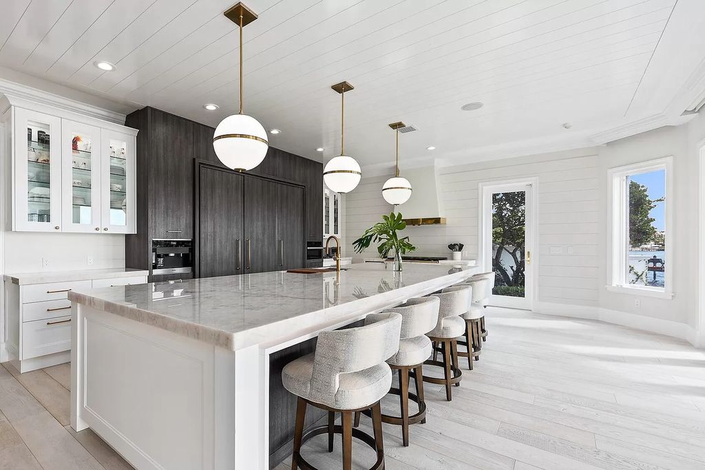 The Home in Jupiter is a newly renovated transitional custom estate with detached guest house, private tennis court and 2 gated entries for complete privacy now available for sale. This home located at 19000 Point Dr, Jupiter, Florida