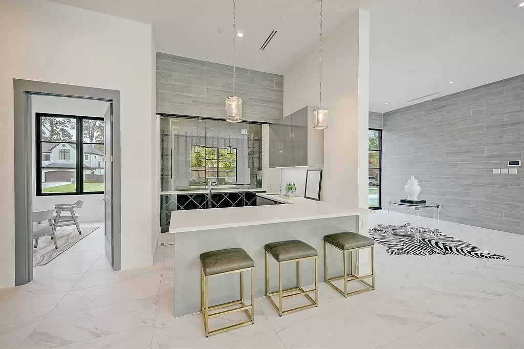 The Home in Houston is a sophisticated contemporary estate on cul de sac in Bunker Hill with smart amenities now available for sale. This home located at 11710 Fidelia Ct, Houston, Texas