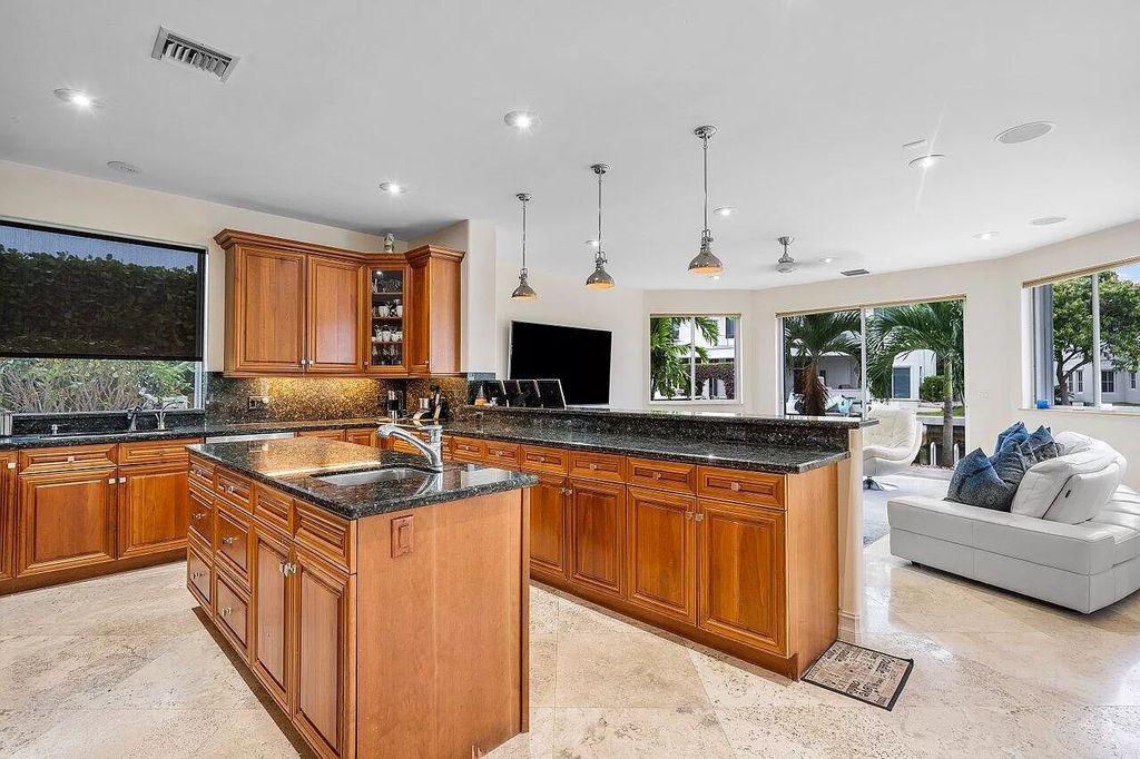 The Home in Boca Raton is a spectacular waterfront estate set on one of Golden Harbour's most coveted lots with jaw dropping long water views now available for sale. This home located at 571 Golden Harbour Dr, Boca Raton, Florida