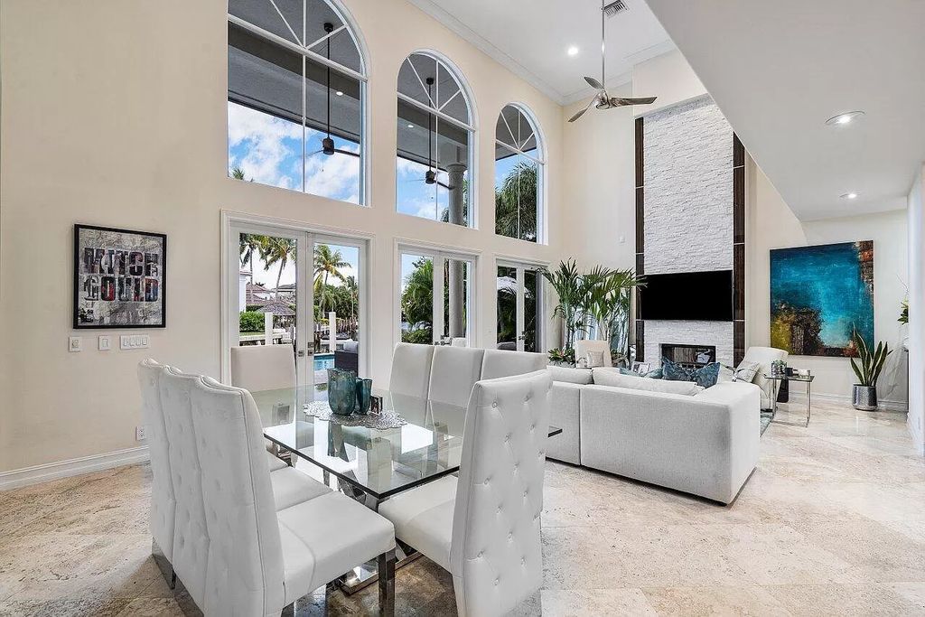 The Home in Boca Raton is a spectacular waterfront estate set on one of Golden Harbour's most coveted lots with jaw dropping long water views now available for sale. This home located at 571 Golden Harbour Dr, Boca Raton, Florida