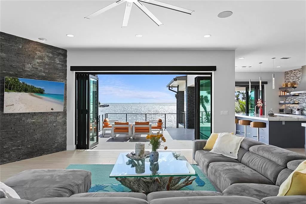 The Home in Tampa is a serene modern dreammaker captivates with fluid indoor-outdoor living and sweeping Bay views now available for sale. This home located at 5030 W San Miguel St, Tampa, Florida