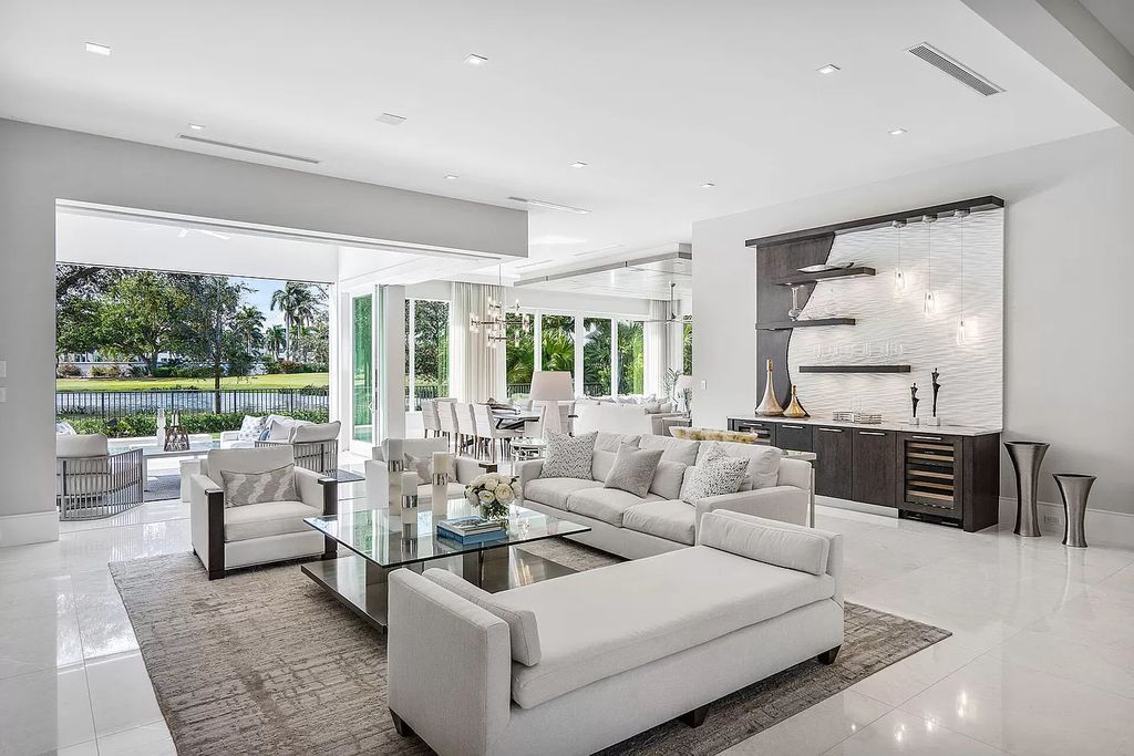 The Home in Boca Raton is on the 14th hole of the Jack Nicklaus Signature golf course with beautiful lake views now available for sale. This home located at 148 Thatch Palm Cv, Boca Raton, Florida