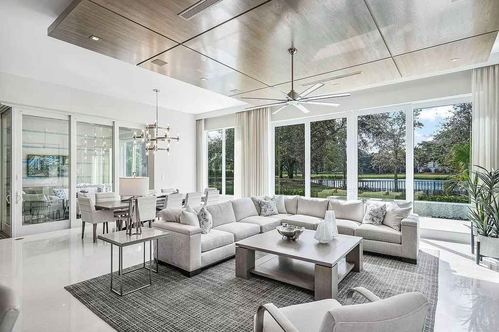 The Home in Boca Raton is on the 14th hole of the Jack Nicklaus Signature golf course with beautiful lake views now available for sale. This home located at 148 Thatch Palm Cv, Boca Raton, Florida