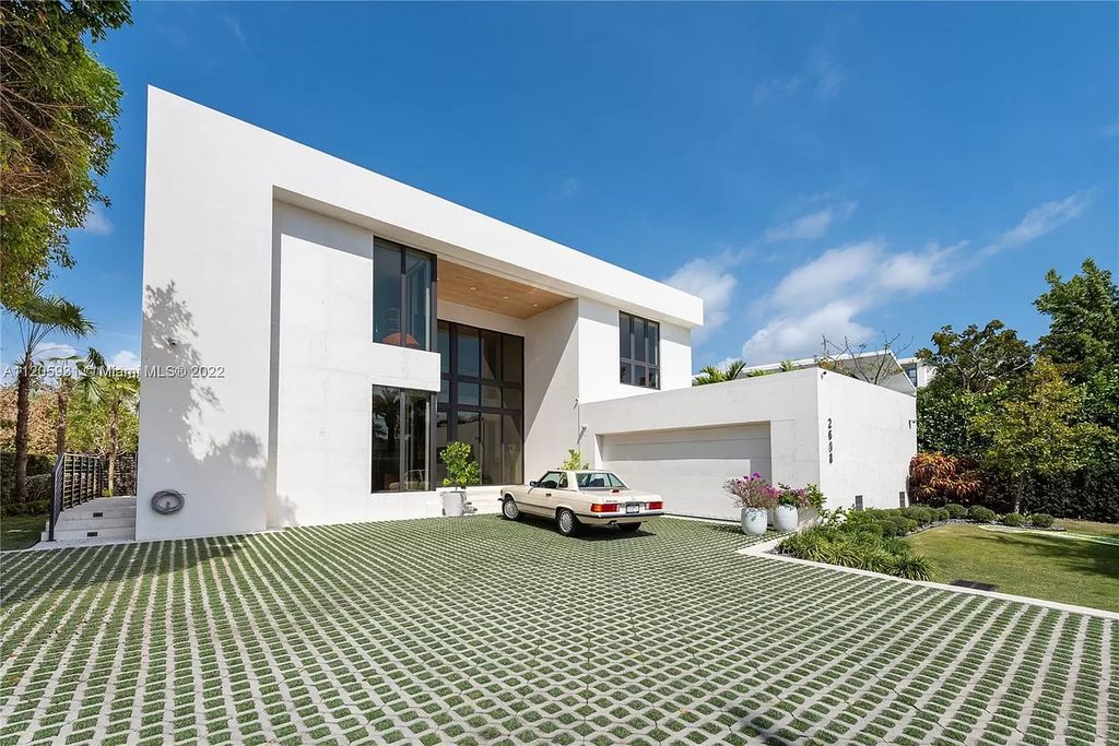 The Home in Miami Beach is a modern waterfront with a western exposure capturing unobstructed water views and dramatic sunsets over Biscayne Bay now available for sale. This home located at 2608 Biarritz Dr, Miami Beach, Florida