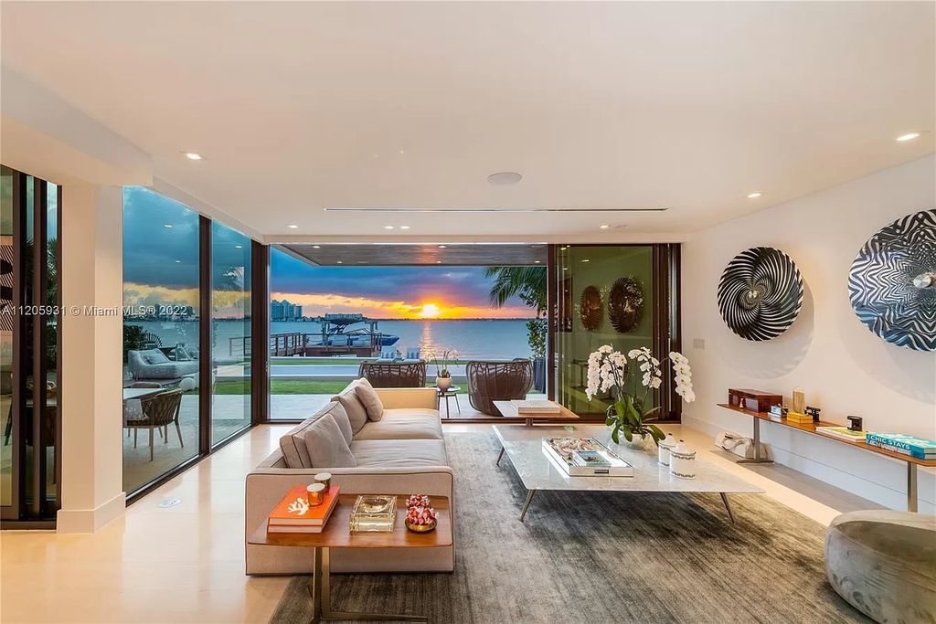 The Home in Miami Beach is a modern waterfront with a western exposure capturing unobstructed water views and dramatic sunsets over Biscayne Bay now available for sale. This home located at 2608 Biarritz Dr, Miami Beach, Florida