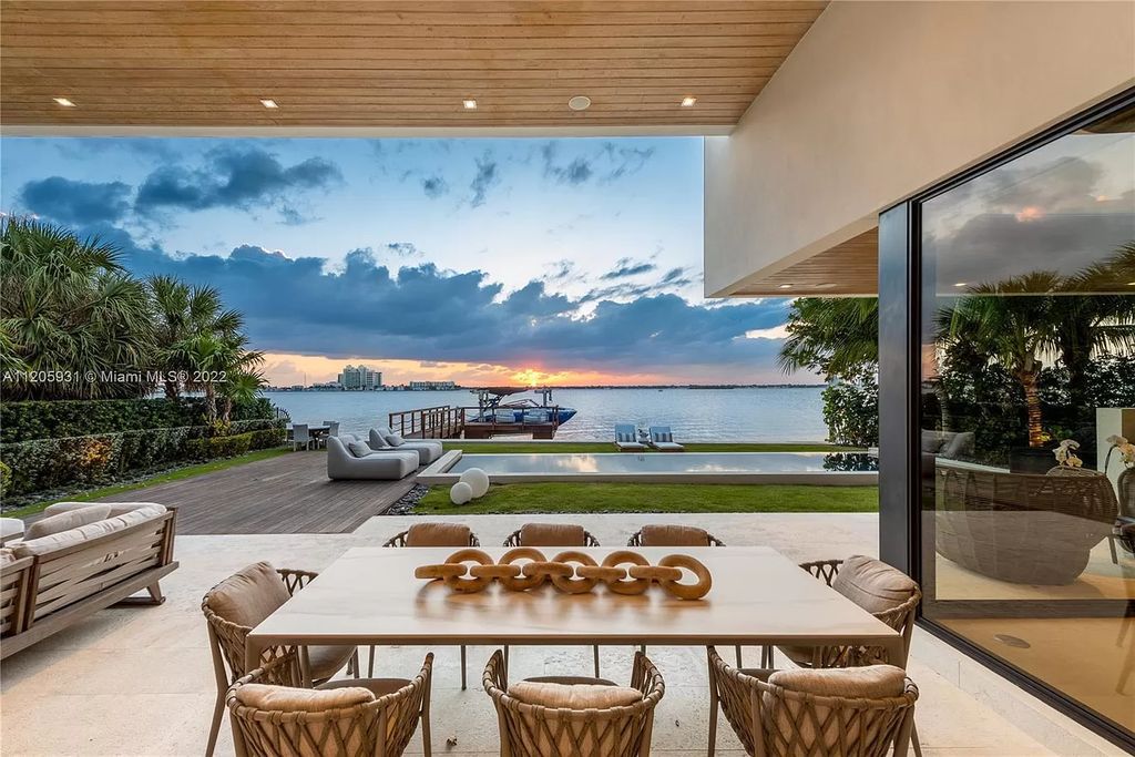 The Home in Miami Beach is a modern waterfront with a western exposure capturing unobstructed water views and dramatic sunsets over Biscayne Bay now available for sale. This home located at 2608 Biarritz Dr, Miami Beach, Florida