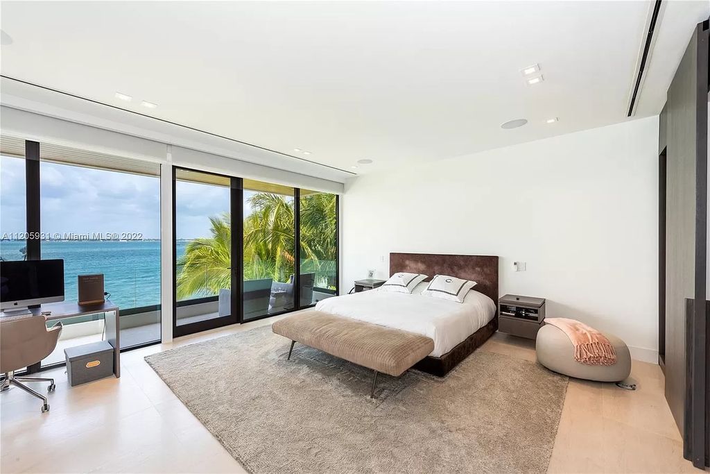 The Home in Miami Beach is a modern waterfront with a western exposure capturing unobstructed water views and dramatic sunsets over Biscayne Bay now available for sale. This home located at 2608 Biarritz Dr, Miami Beach, Florida