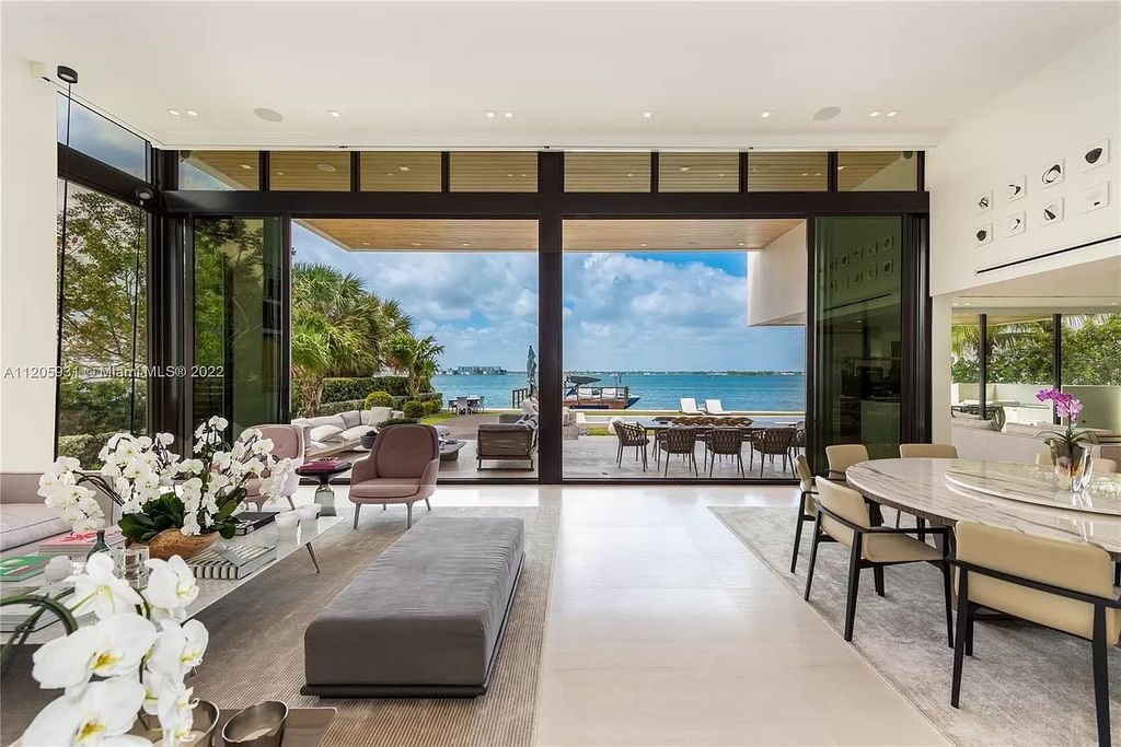 The Home in Miami Beach is a modern waterfront with a western exposure capturing unobstructed water views and dramatic sunsets over Biscayne Bay now available for sale. This home located at 2608 Biarritz Dr, Miami Beach, Florida