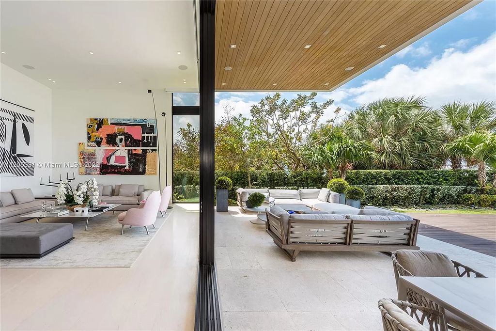 The Home in Miami Beach is a modern waterfront with a western exposure capturing unobstructed water views and dramatic sunsets over Biscayne Bay now available for sale. This home located at 2608 Biarritz Dr, Miami Beach, Florida