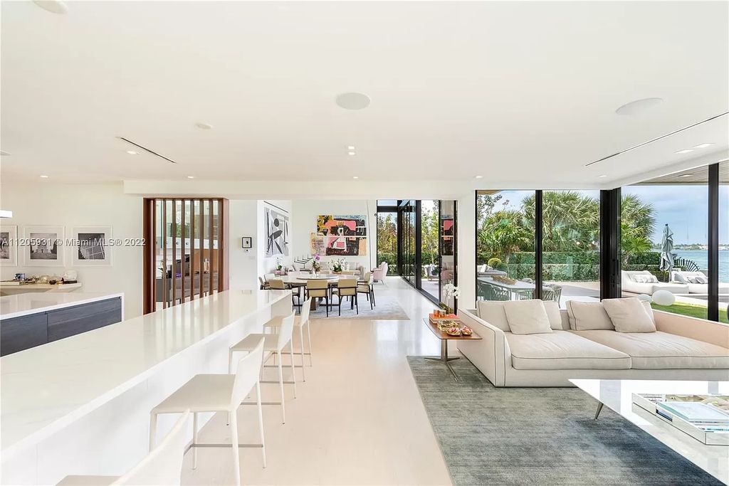 The Home in Miami Beach is a modern waterfront with a western exposure capturing unobstructed water views and dramatic sunsets over Biscayne Bay now available for sale. This home located at 2608 Biarritz Dr, Miami Beach, Florida