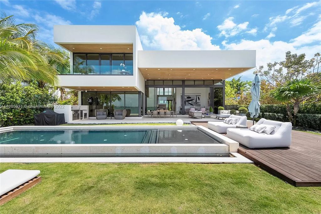 The Home in Miami Beach is a modern waterfront with a western exposure capturing unobstructed water views and dramatic sunsets over Biscayne Bay now available for sale. This home located at 2608 Biarritz Dr, Miami Beach, Florida