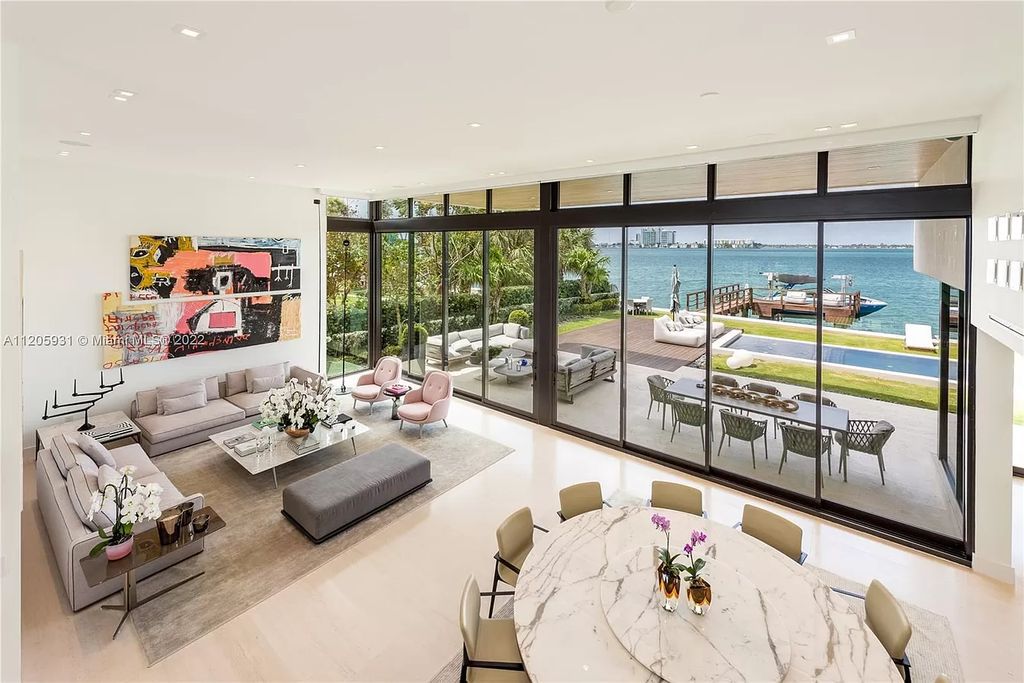 The Home in Miami Beach is a modern waterfront with a western exposure capturing unobstructed water views and dramatic sunsets over Biscayne Bay now available for sale. This home located at 2608 Biarritz Dr, Miami Beach, Florida