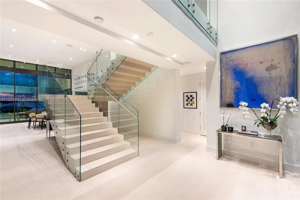 The Home in Miami Beach is a modern waterfront with a western exposure capturing unobstructed water views and dramatic sunsets over Biscayne Bay now available for sale. This home located at 2608 Biarritz Dr, Miami Beach, Florida