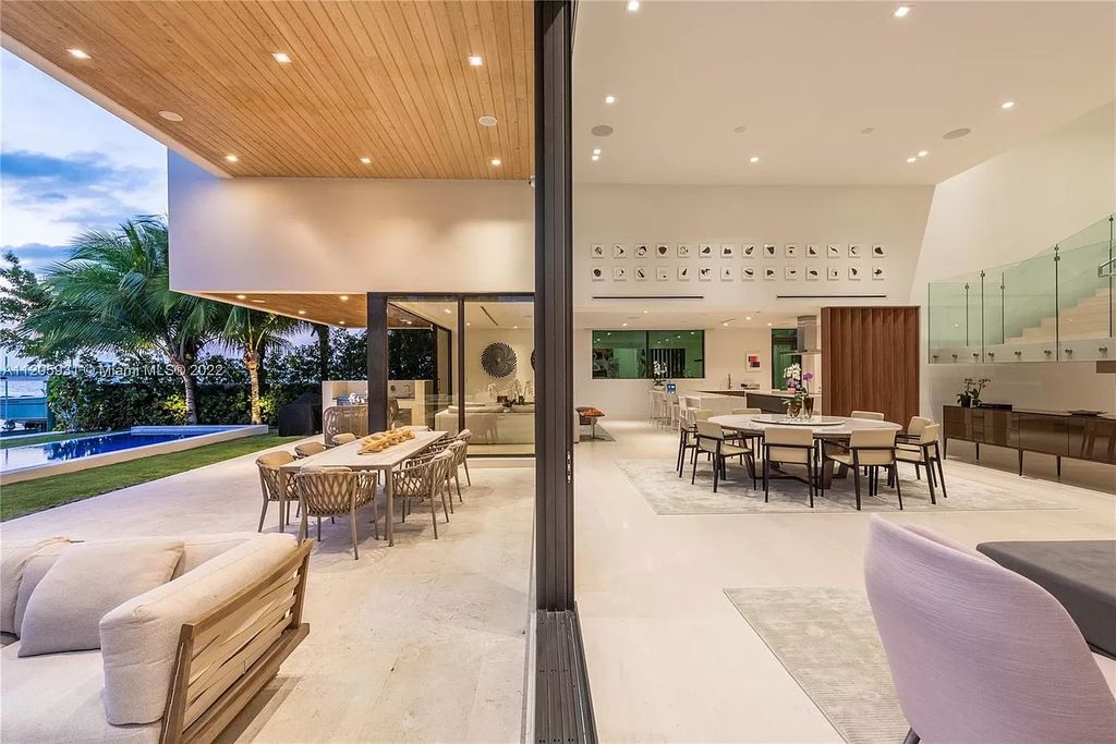 The Home in Miami Beach is a modern waterfront with a western exposure capturing unobstructed water views and dramatic sunsets over Biscayne Bay now available for sale. This home located at 2608 Biarritz Dr, Miami Beach, Florida