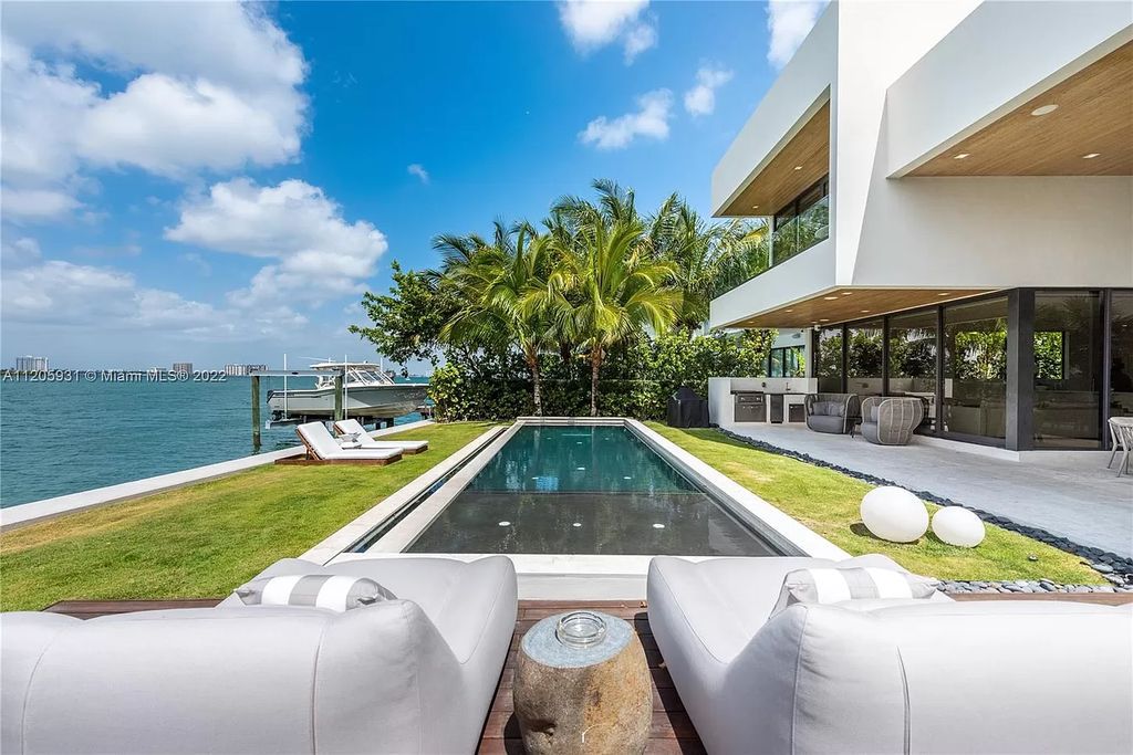 The Home in Miami Beach is a modern waterfront with a western exposure capturing unobstructed water views and dramatic sunsets over Biscayne Bay now available for sale. This home located at 2608 Biarritz Dr, Miami Beach, Florida