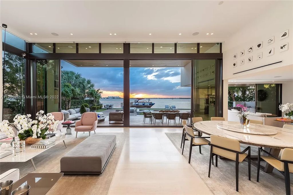 The Home in Miami Beach is a modern waterfront with a western exposure capturing unobstructed water views and dramatic sunsets over Biscayne Bay now available for sale. This home located at 2608 Biarritz Dr, Miami Beach, Florida