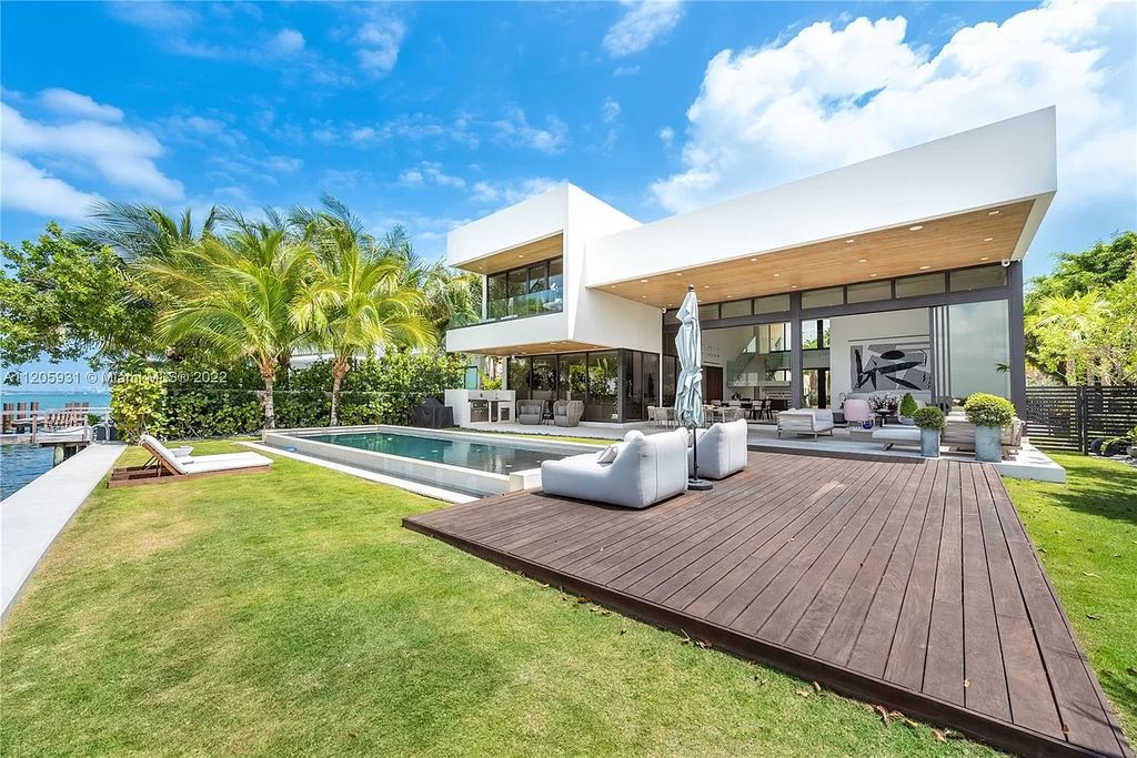 The Home in Miami Beach is a modern waterfront with a western exposure capturing unobstructed water views and dramatic sunsets over Biscayne Bay now available for sale. This home located at 2608 Biarritz Dr, Miami Beach, Florida