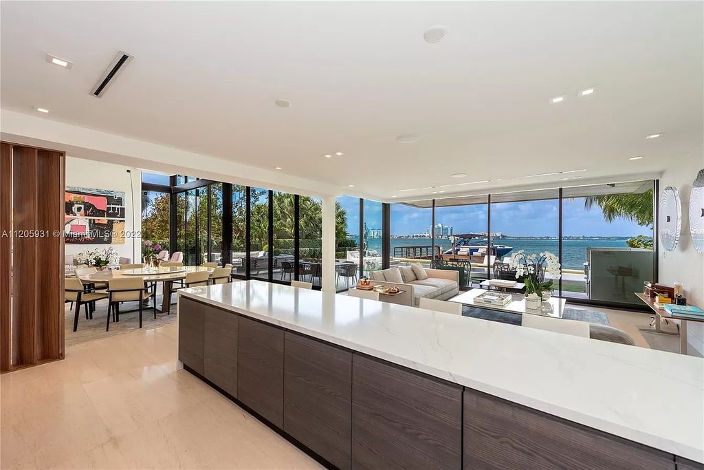 The Home in Miami Beach is a modern waterfront with a western exposure capturing unobstructed water views and dramatic sunsets over Biscayne Bay now available for sale. This home located at 2608 Biarritz Dr, Miami Beach, Florida