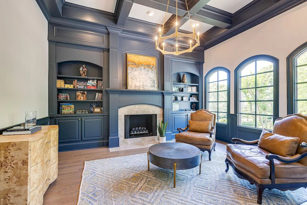 The key to creating a flawless design is to keep the colors in sync. Instead of using a single color for the walls and a different color for the ceiling, as is customary, this living room uses a mix of blue and white for each area. The use of glossy paint materials to reflect light and attract more light to the space is a feature shared by all of these layouts. Blue wooden beams are also becoming popular in this ideas blue living room design.