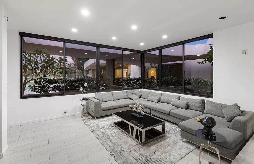The Indian Wells Home is a country club estate was creatively designed around a massive outdoor entertainment pavilion with wraparound view now available for sale. This home located at 77700 Cottonwood Cv, Indian Wells, California