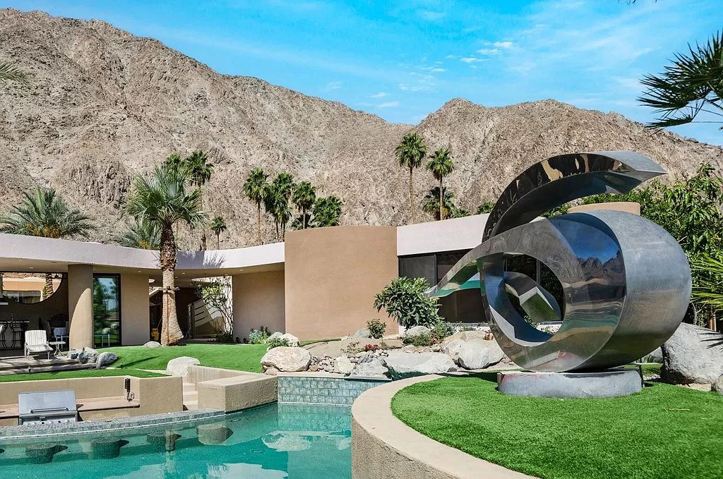 The Indian Wells Home is a country club estate was creatively designed around a massive outdoor entertainment pavilion with wraparound view now available for sale. This home located at 77700 Cottonwood Cv, Indian Wells, California