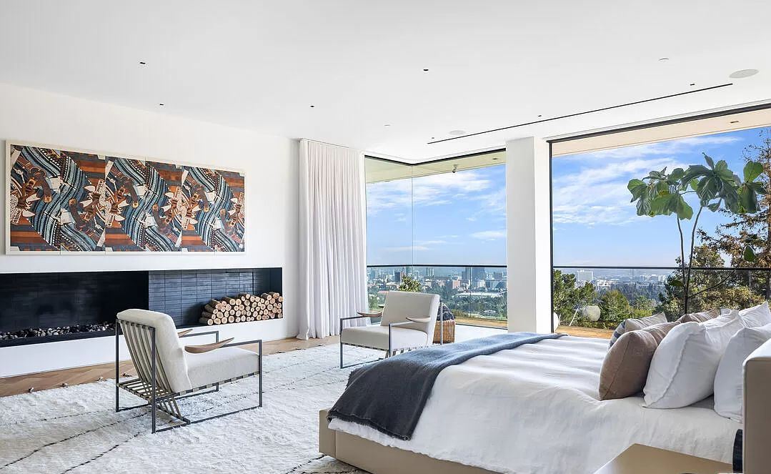 Enjoy the million dollar view from your own bedroom is completely possible. Dividing the bedroom and balcony space with floor to ceiling glass window panels and sliding glass doors to help you free up your eyes. Add a set of curtains in the same tone as the wall paint and you have a bedroom with the view of a luxury retreats.