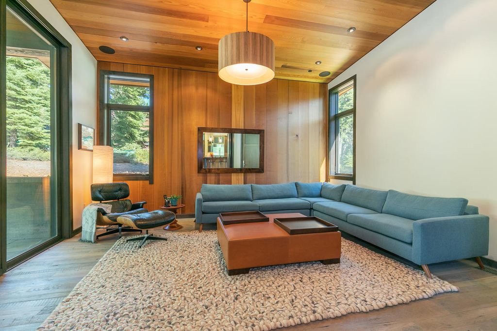 The Home in Truckee is a stunning contemporary residence with Soaring light-filled windows, peaceful greens, warm red cedar, and clean cool rolled steel now available for sale. This home located at 8440 Valhalla Dr, Truckee, California