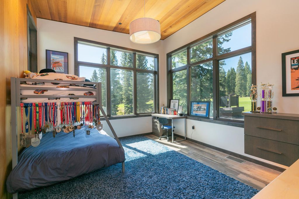 The Home in Truckee is a stunning contemporary residence with Soaring light-filled windows, peaceful greens, warm red cedar, and clean cool rolled steel now available for sale. This home located at 8440 Valhalla Dr, Truckee, California