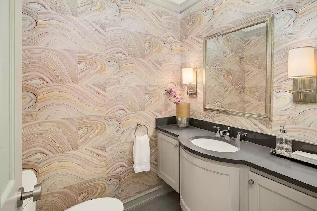 Bathroom walls with wallpaper don't always have to seem dated. The proper wallpaper might help you modernize your area instead. Consider wallpaper with geometric designs or color-blocked wallpaper if you're staying with a more contemporary design scheme. While striped wallpaper is a timeless option for seaside bathrooms, floral wallpaper pairs wonderfully with cottage-style bathrooms. Install strong wallpaper halfway up your wall, similar to wainscoting, if you're worried it will overpower your space.