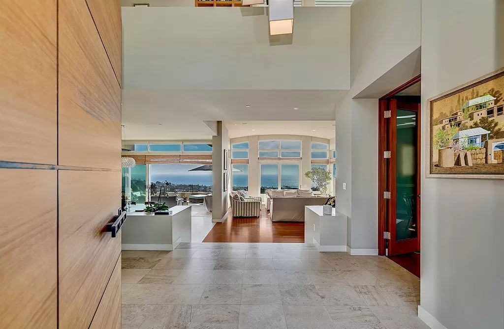 The Home in La Jolla is a classic contemporary estate has sweeping panoramic views of both the ocean and La Jolla Country Club Golf Course now available for sale. This house located at 6848 Country Club Dr, La Jolla, California