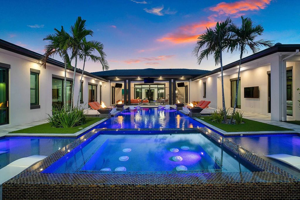 The Home in Delray Beach is a striking custom-built estate with the grand open concept, luxury finishes and modern architectural millwork now available for sale. This home located at 5526 Vintage Oaks Ter, Delray Beach, Florida