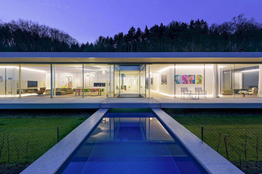 Villa K lies long and low on a German hillside by Paul de Ruiter Architects