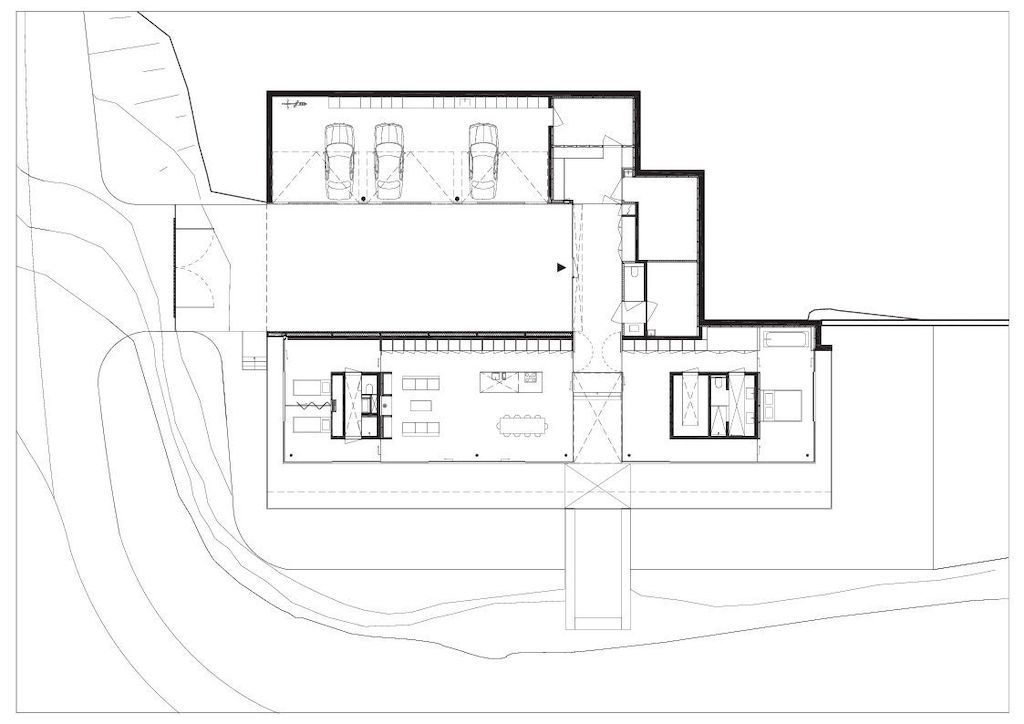 Villa K lies long and low on a German hillside by Paul de Ruiter Architects