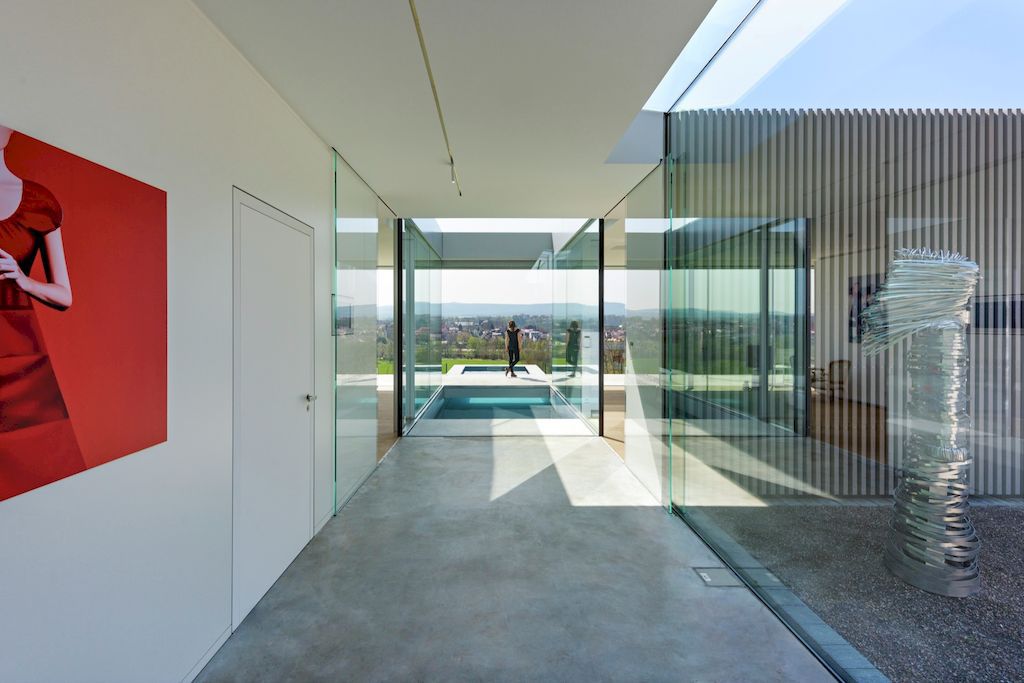 Villa K lies long and low on a German hillside by Paul de Ruiter Architects