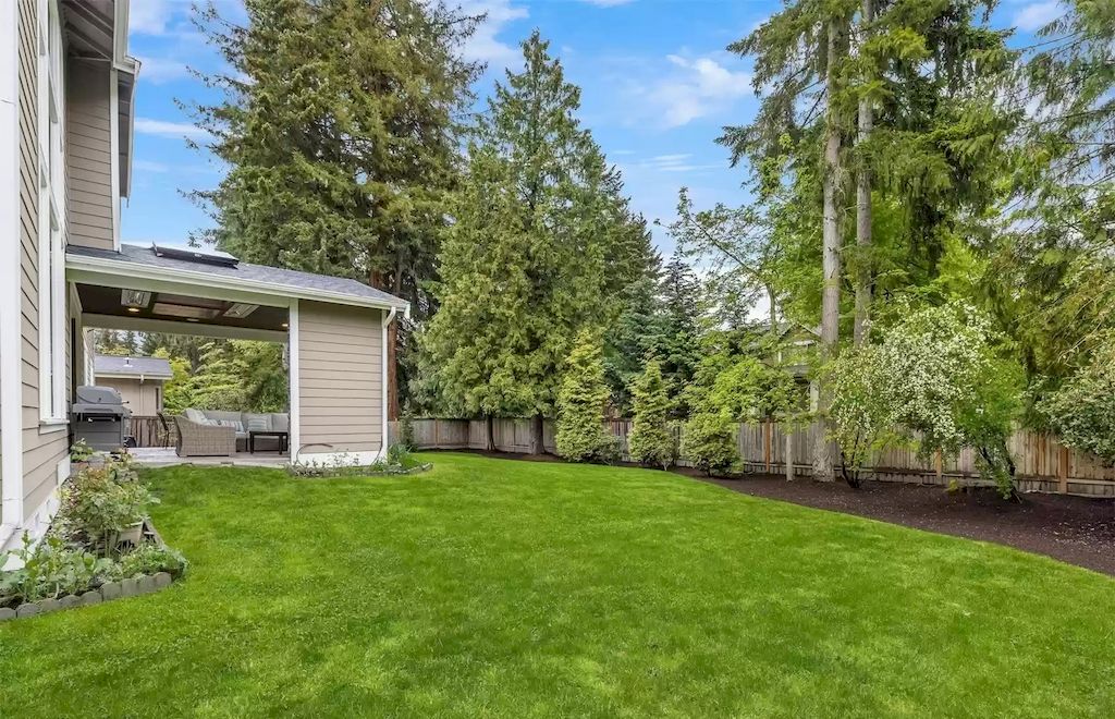 The Estate in Bellevue offers great outdoor living with the expansive flat yard and private covered patio, now available for sale. This home located at 2832 109th Avenue SE, Bellevue, Washington