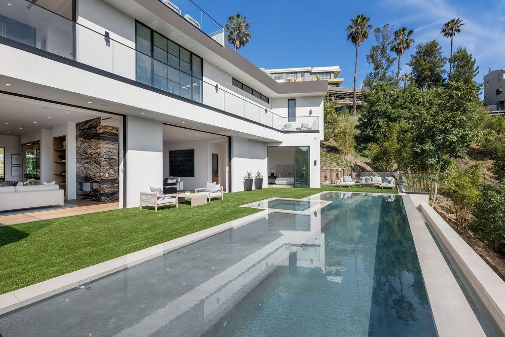 The Home in Beverly Hills is a newly constructed warm California contemporary high performance living experience now available for sale. This home located at 1635 Ferrari Dr, Beverly Hills, California