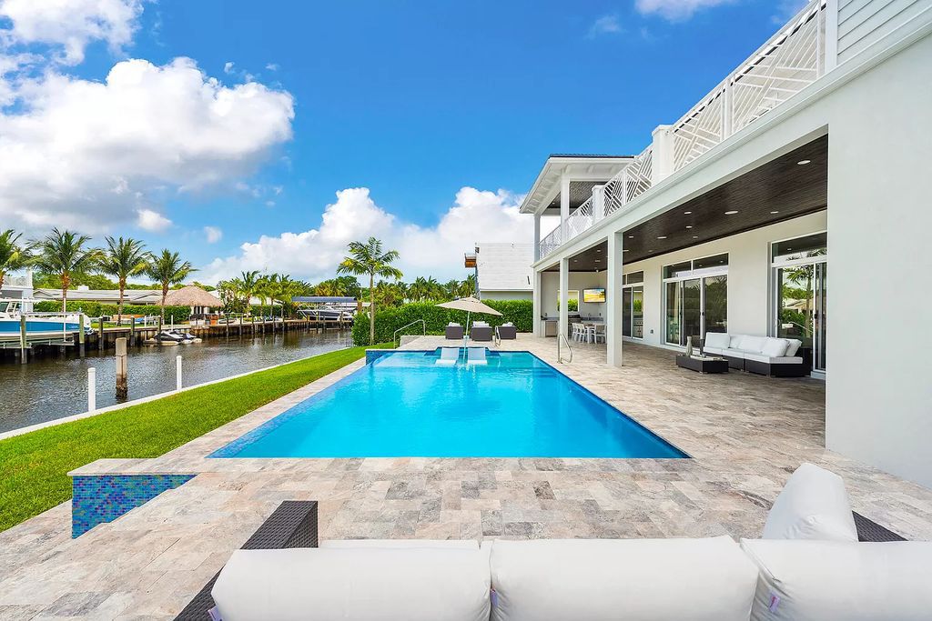 The Palm Beach Gardens Home is a newer custom built luxurious residence with high end finishes throughout now available for sale. This house located at 2169 Driftwood Cir, Palm Beach Gardens, Florida