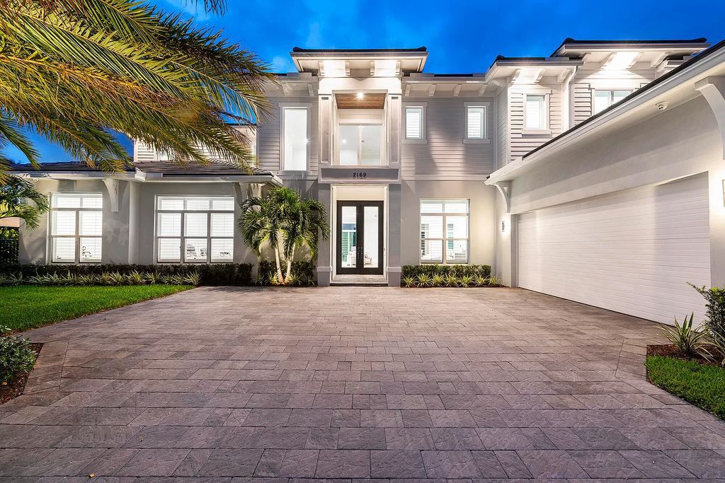 The Palm Beach Gardens Home is a newer custom built luxurious residence with high end finishes throughout now available for sale. This house located at 2169 Driftwood Cir, Palm Beach Gardens, Florida