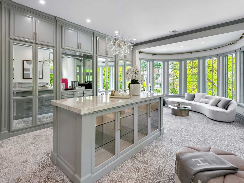 The Home in Encino is an East Hamptons style property offers resort-style living within the prestigious guard-gated Royal Oaks Colony now available for sale. This home located at 11630 Moraga Ln, Encino, California