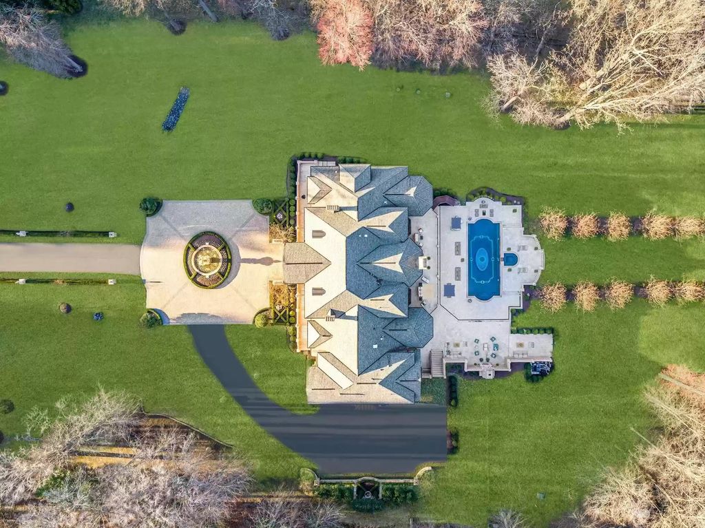 The Estate in Virginia has elegance outdoor areas with an extensive limestone patio surrounding the mosaic-lined swimming pool, now available for sale