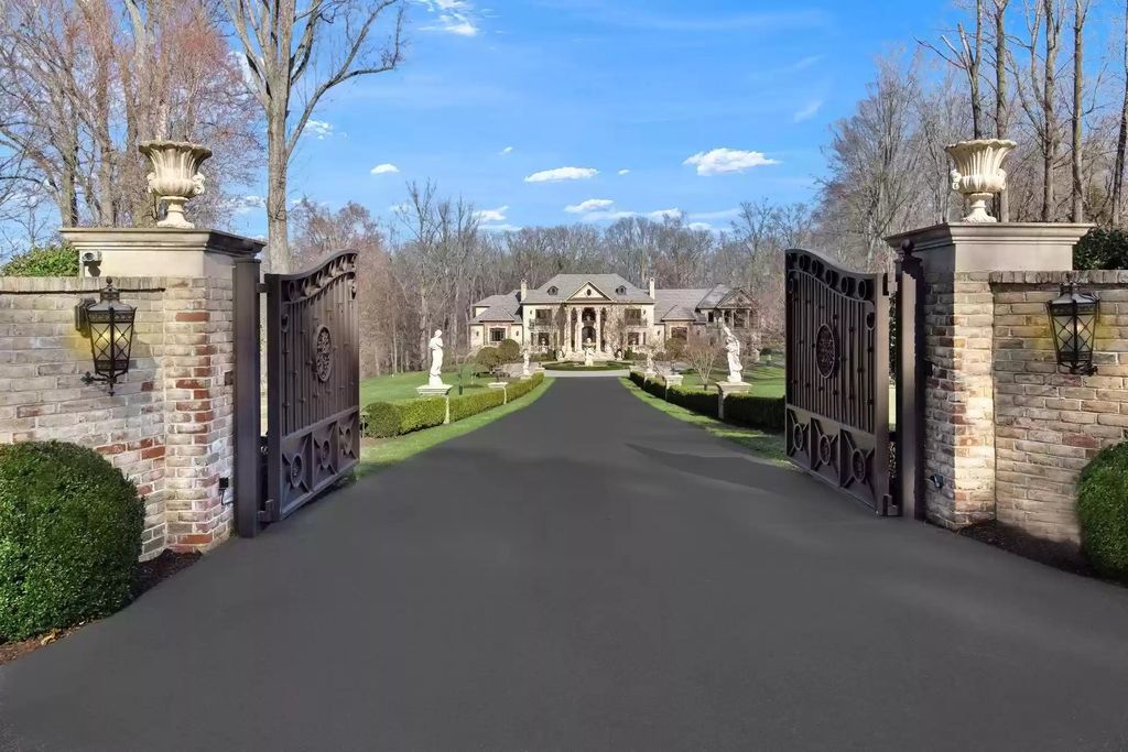 The Estate in Virginia has elegance outdoor areas with an extensive limestone patio surrounding the mosaic-lined swimming pool, now available for sale