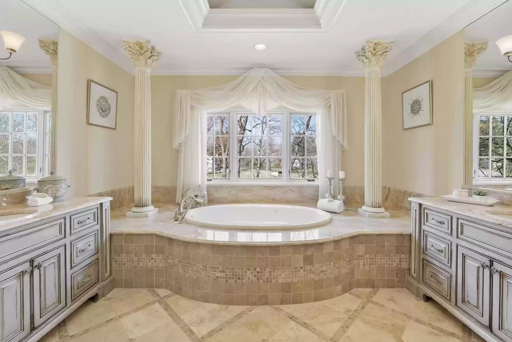 The Estate in Virginia has elegance outdoor areas with an extensive limestone patio surrounding the mosaic-lined swimming pool, now available for sale