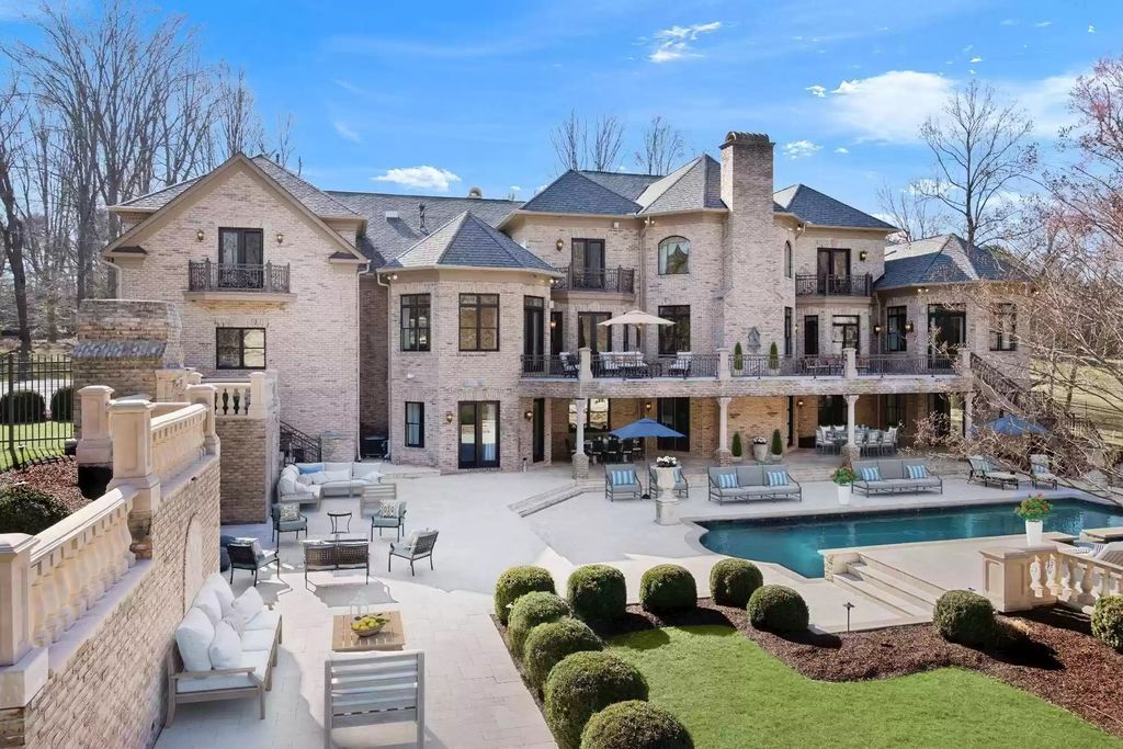 The Estate in Virginia has elegance outdoor areas with an extensive limestone patio surrounding the mosaic-lined swimming pool, now available for sale