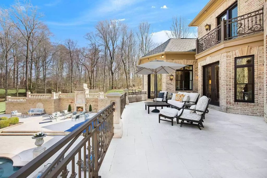 The Estate in Virginia has elegance outdoor areas with an extensive limestone patio surrounding the mosaic-lined swimming pool, now available for sale