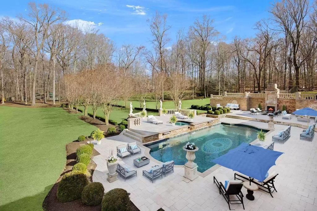 The Estate in Virginia has elegance outdoor areas with an extensive limestone patio surrounding the mosaic-lined swimming pool, now available for sale