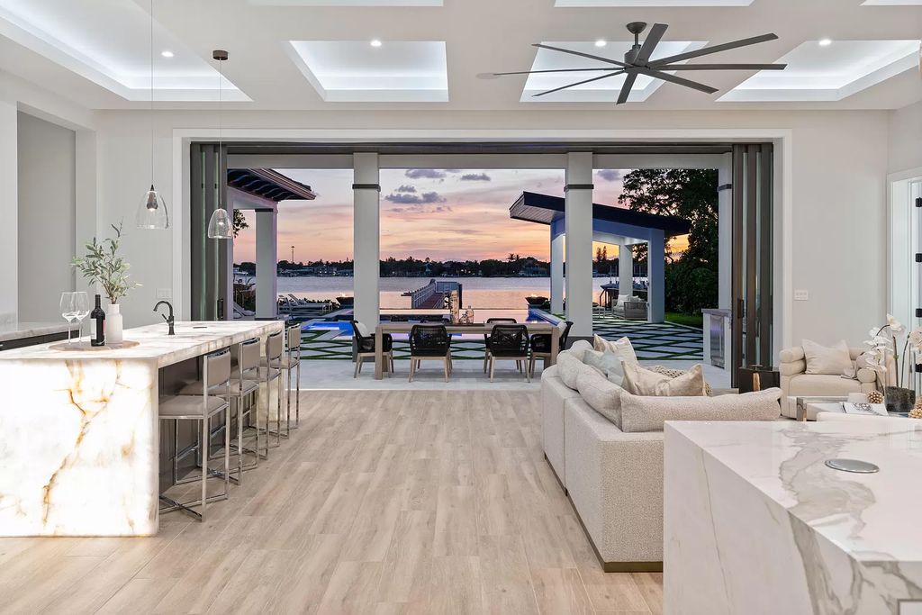 The Home in Lake Worth is a brand new construction on Hypoluxo Island with stunning modern contemporary design and insane wide Intracoastal views now available for sale. This home located at 701 S Atlantic Dr, Lake Worth, Florida